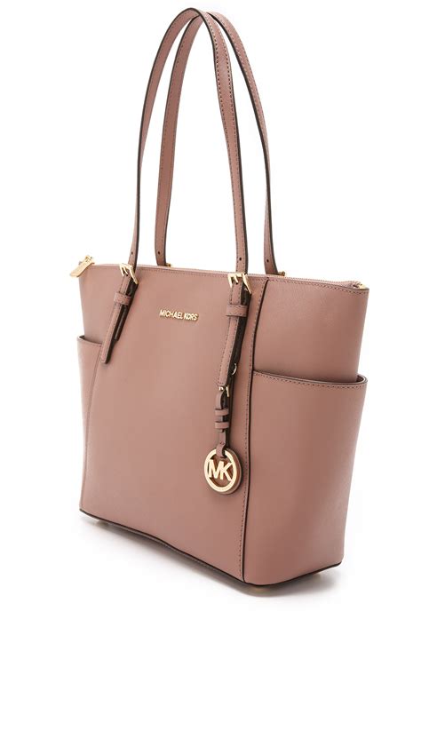 michael kors rose print bag|Michael Kors pink suitcase.